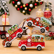 Decorative Christmas trucks on a wooden stand with festive background