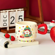 "Ceramic Christmas gift mug with Santa topper and spoon"