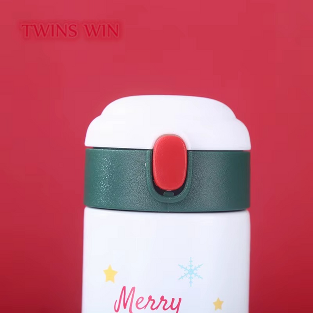 Festive holiday water bottles on red and green background with Christmas banner