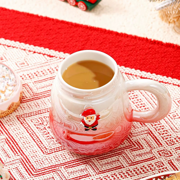 Holiday-themed snow globe coffee mugs featuring Santa and Christmas tree decorations