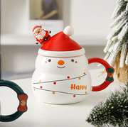 “Holiday ceramic mug with Santa hat lid in red and green colors”